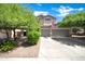 Beautiful two-story home with a three-car garage and well-maintained landscaping at 10430 W Los Gatos Dr, Peoria, AZ 85383