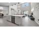 Bright, open-concept living room features high ceilings and a seamless flow to the kitchen and dining areas at 10430 W Los Gatos Dr, Peoria, AZ 85383