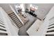 Open-concept living space with a view of the stairs, kitchen, and outdoor patio at 10430 W Los Gatos Dr, Peoria, AZ 85383