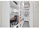 Walk-in pantry with shelves to organize all your food, small appliances, and kitchen essentials at 10430 W Los Gatos Dr, Peoria, AZ 85383