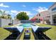Beautiful backyard featuring a sparkling pool, lounge chairs, a barbecue, and an umbrella, perfect for relaxing at 10430 W Los Gatos Dr, Peoria, AZ 85383