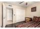 This bedroom features dark wood floors, a ceiling fan, and a closet with paneled doors at 10820 N 45Th Dr, Glendale, AZ 85304