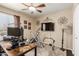 A modern ceiling fan and a large window provide ample light in this room with a carpeted floor at 10820 N 45Th Dr, Glendale, AZ 85304
