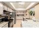 Spacious kitchen featuring granite countertops, stainless steel appliances, tiled flooring, and lots of natural light at 10820 N 45Th Dr, Glendale, AZ 85304
