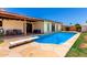 This beautiful pool features a diving board and is surrounded by tile and grass in a private backyard at 10820 N 45Th Dr, Glendale, AZ 85304
