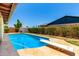 Beautiful pool with diving board in a spacious, private backyard with secure fencing and professional landscaping at 10820 N 45Th Dr, Glendale, AZ 85304