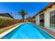 Enjoy the beautiful pool with tile surround and a well-manicured lawn under a clear blue sky at 10820 N 45Th Dr, Glendale, AZ 85304