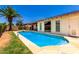 Enjoy the outdoors with this gorgeous pool surrounded by a large patio and landscaping for privacy at 10820 N 45Th Dr, Glendale, AZ 85304