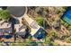 Aerial view of home featuring a pool, patio, desert landscaping, and mountain views at 11089 N 130Th Pl, Scottsdale, AZ 85259