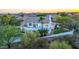 Exterior shot showing a balcony, manicured lawn, and desert landscape in the backyard at 11089 N 130Th Pl, Scottsdale, AZ 85259