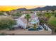 Aerial shot of backyard featuring a pool, desert landscape, and an outdoor living area at 11089 N 130Th Pl, Scottsdale, AZ 85259