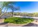 Fenced backyard with artificial grass and desert views at 11089 N 130Th Pl, Scottsdale, AZ 85259