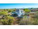 Exterior of home featuring a balcony, desert landscaping, and mountain views at 11089 N 130Th Pl, Scottsdale, AZ 85259