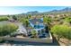 Aerial of back exterior featuring an outdoor balcony, pool, patio, and desert landscaping at 11089 N 130Th Pl, Scottsdale, AZ 85259
