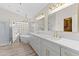 Luxurious bathroom featuring dual vanities, a standalone tub, and a glass-enclosed shower at 11089 N 130Th Pl, Scottsdale, AZ 85259