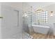 Modern bathroom featuring a glass-enclosed shower, standalone tub, and stylish fixtures at 11089 N 130Th Pl, Scottsdale, AZ 85259