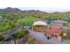 Aerial view of the community playground surrounded by mature desert landscape and mountains at 11089 N 130Th Pl, Scottsdale, AZ 85259