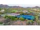 Aerial view of community tennis and basketball courts with mountains in the background at 11089 N 130Th Pl, Scottsdale, AZ 85259