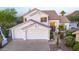Beautiful two-story home featuring a three-car garage, stucco, and desert landscape at 11089 N 130Th Pl, Scottsdale, AZ 85259