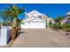 Spacious three-car garage home with palm trees in the front yard at 11089 N 130Th Pl, Scottsdale, AZ 85259