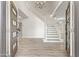 Grand foyer with a staircase and chandelier exudes elegance, with wood floors at 11089 N 130Th Pl, Scottsdale, AZ 85259