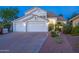 Charming two-story home featuring a three-car garage and mature landscaping at 11089 N 130Th Pl, Scottsdale, AZ 85259