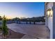 Well-maintained front yard and spacious driveway with desert landscaping provide curb appeal and convenience at 11089 N 130Th Pl, Scottsdale, AZ 85259