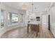 Bright kitchen showcasing white cabinets, an island with seating, and stainless appliances at 11089 N 130Th Pl, Scottsdale, AZ 85259