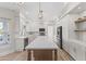 Gorgeous updated kitchen with white cabinets, stainless appliances, and oversized island perfect for entertaining at 11089 N 130Th Pl, Scottsdale, AZ 85259