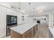 Gourmet kitchen featuring built-in refrigerator, a spacious island with seating, and sleek, modern fixtures at 11089 N 130Th Pl, Scottsdale, AZ 85259