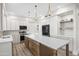 Open concept kitchen features stainless appliances, stone counters, and a large island at 11089 N 130Th Pl, Scottsdale, AZ 85259