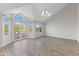 Spacious living room with high ceilings, a chandelier, and French doors to a patio at 11089 N 130Th Pl, Scottsdale, AZ 85259