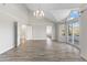 Bright and spacious main bedroom with wood floors, a chandelier, and mountain views at 11089 N 130Th Pl, Scottsdale, AZ 85259