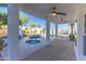 Covered patio overlooking a backyard pool, spa, and desert landscaping at 11089 N 130Th Pl, Scottsdale, AZ 85259
