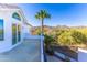 Exterior view of patio with mountain views and lush desert landscaping at 11089 N 130Th Pl, Scottsdale, AZ 85259