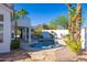 Backyard pool with mature palm trees and desert landscaping at 11089 N 130Th Pl, Scottsdale, AZ 85259