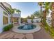 Private outdoor pool featuring mature palm trees and desert landscape in the backyard at 11089 N 130Th Pl, Scottsdale, AZ 85259