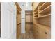 Spacious walk-in closet with custom shelving and drawers for optimal organization at 11089 N 130Th Pl, Scottsdale, AZ 85259