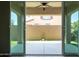 View of back patio and yard through sliding glass doors at 1255 N Arizona Ave # 1300, Chandler, AZ 85225