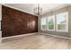 Chic bedroom with hardwood floors, a copper accent wall, and modern lighting, offering a sophisticated retreat at 1255 N Arizona Ave # 1300, Chandler, AZ 85225