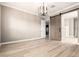 Spacious bedroom with a modern light fixture and a unique sliding barn door at 1255 N Arizona Ave # 1300, Chandler, AZ 85225