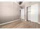 Neutral bedroom featuring hardwood floors, closet, chandelier, and interior door at 1255 N Arizona Ave # 1300, Chandler, AZ 85225
