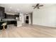 Open-concept living space with wood floors seamlessly connects the living and kitchen areas at 1255 N Arizona Ave # 1300, Chandler, AZ 85225