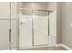 Shower showcasing a glass enclosure with a built-in seat at 1255 N Arizona Ave # 1300, Chandler, AZ 85225