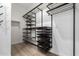 Walk-in closet featuring custom shelves and hanging racks for optimal organization at 1255 N Arizona Ave # 1300, Chandler, AZ 85225