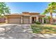 Charming single-story home featuring a three-car garage and a well-manicured front yard at 1474 E Locust Dr, Chandler, AZ 85286