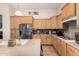 Well-lit kitchen features stainless appliances and spacious counters, ideal for cooking at 1474 E Locust Dr, Chandler, AZ 85286