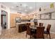 Bright kitchen with stainless steel appliances, a center island, and an adjacent dining area at 1474 E Locust Dr, Chandler, AZ 85286
