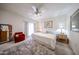 Spacious bedroom with ceiling fan, window, and inviting furnishings, creating a comfortable and airy space at 15225 N 100Th St # 1185, Scottsdale, AZ 85260