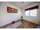 Bedroom space with laminate flooring and one large window offering natural light at 15225 N 100Th St # 1185, Scottsdale, AZ 85260